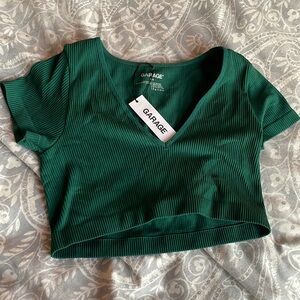 Garage, dark green seamless, V-neck tee color, rainforest size small